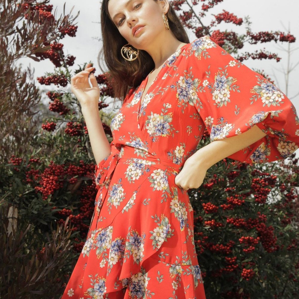 Yumi Kim Love wins daisy bouquet Blood Orange Red floral wrap dress